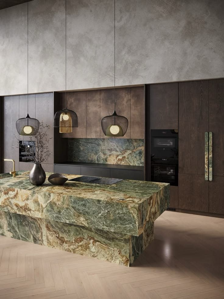 Modern kitchen with a green marble island, dark wood cabinets, and mesh pendant lights.